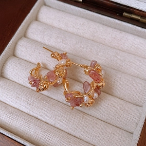 Macro detail of 18k gold plated rose earrings with strawberry quartz and pearls