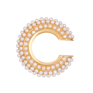 Luxurious gold C-shaped ear cuff with pave set pearls and elegant minimalist design
