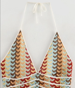 Close-up of multicolor crochet halter top with chevron texture and knitted V-neck detail