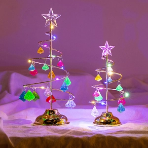 Detail of golden spiral Christmas tree lamps with colorful crystal pendants and LED lights