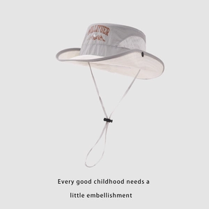 Detail of kids breathable mesh sun hat with adjustable chin strap and mountain print