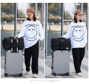 Detail of black sports bag with suitcase handle strap for easy travel convenience