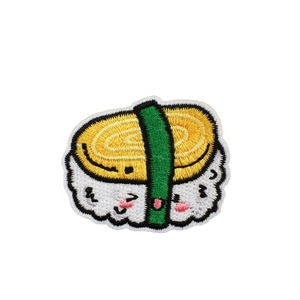 Japanese sushi embroidery patch featuring a cute cartoon tamagoyaki egg design