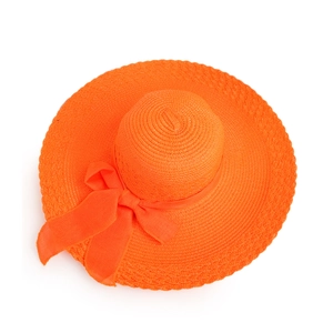 Detailed top view of orange straw sun hat showing woven texture and ribbon bow