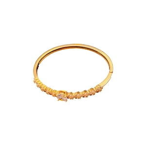 Gold plated bracelet with zircon flower design on a clean white background