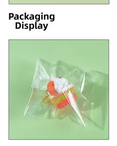 Miniature food charm featuring strawberry cream sundae in clear packaging with bead chain