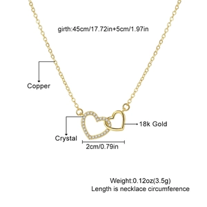 Detail of interlocking heart pendant with 18k gold plating and shimmering cubic zirconia