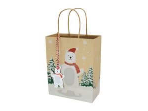 Detail view of a Christmas paper gift bag with polar bear print and tree patterns