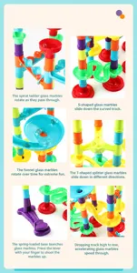 Detailed close-up of marble run track parts including spiral stairs and ejection slides