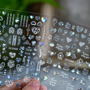 Detail of Valentine's Day nail stickers with laser heart and romantic text patterns