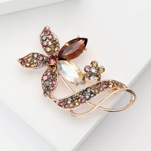 Elegant rose gold flower brooch featuring colorful crystals and sparkling rhinestones