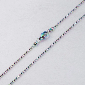 Close-up of rainbow stainless steel bead chain necklace with lobster clasp connector