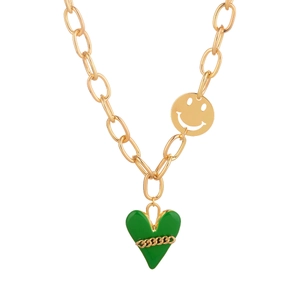 Gold chain necklace with green heart pendant and smiley face charm on white background