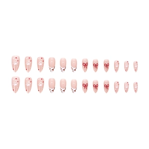 French almond press-on nails with cream leopard print and red bow tie designs