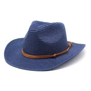 Close-up of the woven texture and brown leather strap on this navy blue cowboy straw hat