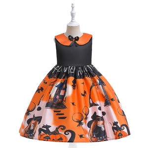 Detail of Halloween pumpkin dress waist featuring HALLOWEEN text and satin texture
