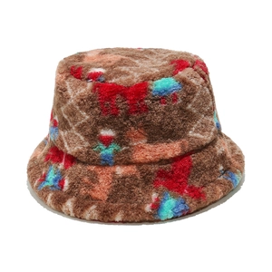 Detailed view of brown plush bucket hat with thick colorful pixelated pattern texture