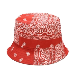 Red paisley bucket hat with white pattern for unisex streetwear and sun protection