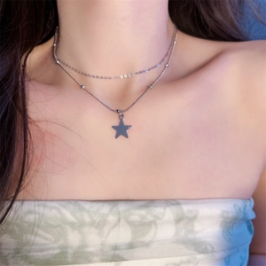Double-layered silver star necklace featuring a sleek snake chain for a stylish women look