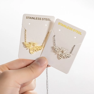 Hollow origami bee pendant bracelet in gold and silver finish made of stainless steel