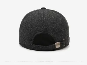 Detail view of the gray wool baseball cap back showing adjustable metal buckle and stitching
