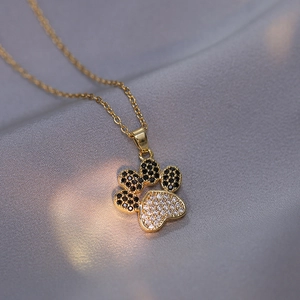 Elegant gold cat paw necklace with sparkling red and white zircon pendant for women