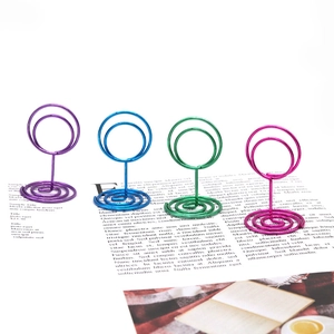 Colorful creative wire table number holders in purple blue green and magenta metal