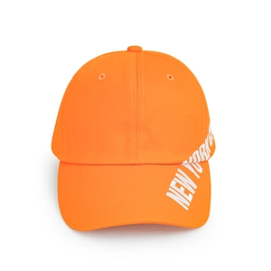 Detail view of bright orange baseball cap with white 3D New York embroidery text