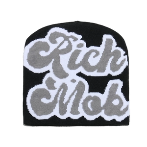 Detail of the Rich Mob jacquard knit on a black streetwear beanie with thick double layers