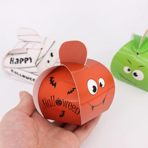 Handheld Halloween candy boxes featuring cute pumpkin, mummy, and monster designs