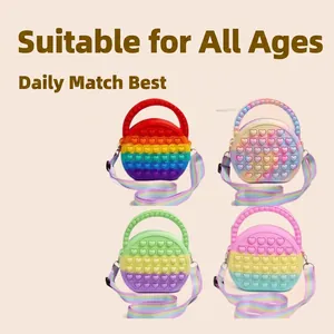 Set of heart-shaped silicone pop-it shoulder bags in colorful rainbow and macaron gradient