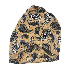 Detail of ginger paisley pattern on a soft plush beanie hat for men and women