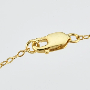 Macro shot of gold-plated S925 sterling silver lobster clasp and jewelry chain details
