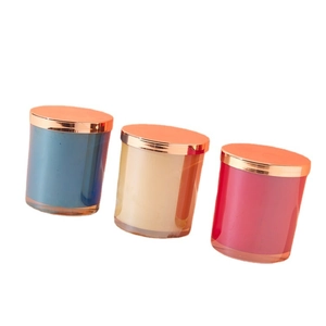 Luxury electroplated glass candle jars in blue, beige, and red with gold metal lids