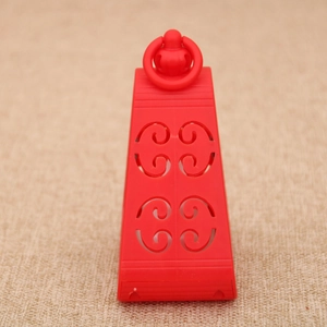 Detail showing the red decorative lamp with hollow pattern and convenient hanging loop