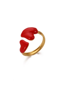 Detail of adjustable gold-plated stainless steel ring with dual red enamel hearts