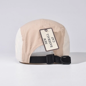 Detail view of khaki and cream baseball cap with nylon strap and D-ring buckle
