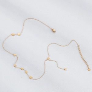 Detailed view of gold stainless steel necklace featuring multiple star charms and lobster clasp