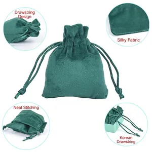 Dark green velvet drawstring jewelry pouch with smooth fabric and neat stitching detail