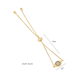 Macro view of adjustable evil eye bracelet in gold finish with zircon inlay and 24cm length
