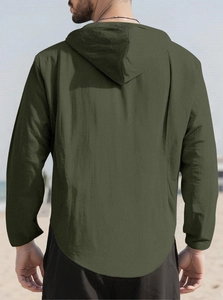 Back view of army green men's hooded shirt showing premium cotton linen texture at the beach