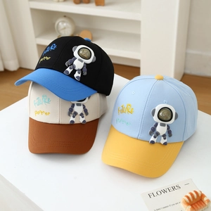 Kids baseball hat featuring 3D astronaut figure and Future Partner embroidery on side