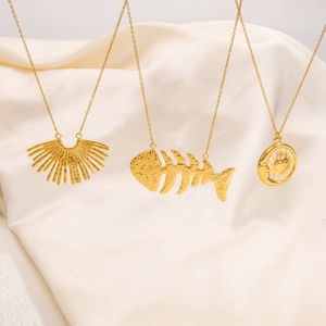 Minimalist 18k gold plated necklaces featuring semicircle, fishbone, and sun pendants
