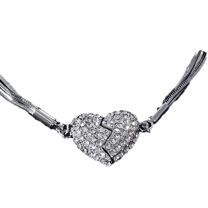 Silver heart magnet necklace with diamond accents and layered snake chain design