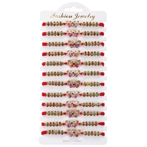 Detailed set of 12 red woven butterfly charm bracelets on fashion display card