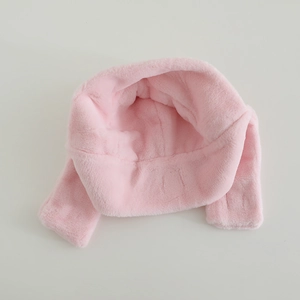 Detail view of pink plush lining and soft faux fur texture for children winter hat