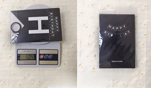 Weight measurement of black Happy Birthday paper banner in 13x20cm sealed packaging