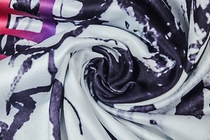 Detail of purple and blue abstract print on high-elasticity sports bodysuit fabric