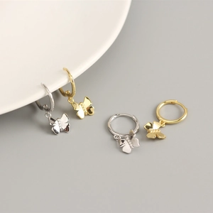 Detail showing S925 sterling silver butterfly hoop earrings in gold and silver finishes