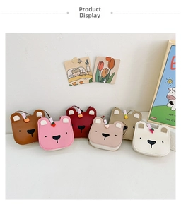 Detail showing various colors of bear-shaped crossbody bags with cute fruit decorations